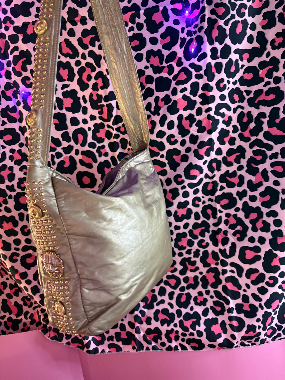 Studded fringe zipper lion head detailed metallic hobo bag